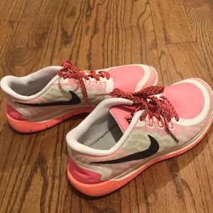 Orange Nike athletic shoes